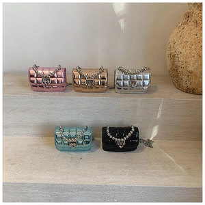Mini quilted patent leather handbags in five colors with pearl handles and chain straps