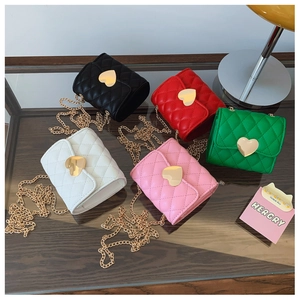 Detailed top view of mini quilted crossbody bags with gold heart buckles in five colors