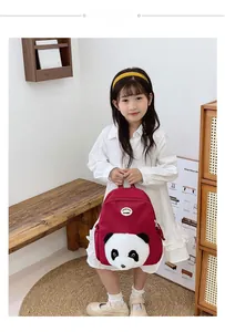 Toddler backpack featuring a 3D plush panda face on deep red fabric with shoulder straps