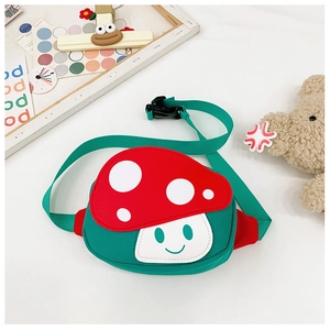 Close-up of cute mushroom-shaped kids waist bag with green adjustable strap and buckle