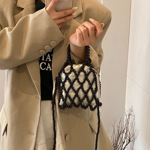 Handmade beaded shoulder bag with black pearls, white satin pouch and metal chain strap