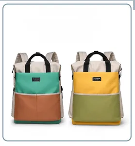 Dual comparison of large capacity diaper bags in green and yellow contrast colors