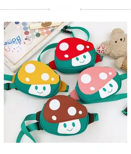 Detail of four colorful mushroom crossbody bags for kids with adjustable nylon straps