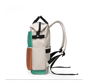 Side view showing the thickness and green contrast color panels of the multi-pocket diaper bag