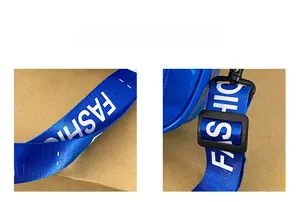 Close-up of blue nylon bag strap with white FASHION lettering and adjustable buckle