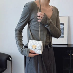 White quilted mini crossbody bag for girls with gold heart lock and chain strap