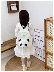 Close-up of the 3D plush panda head design on the back of this white toddler backpack