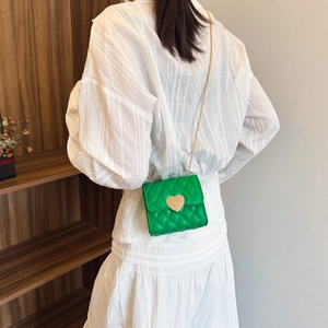 Quilted green girls' crossbody bag with gold heart lock and metal chain strap