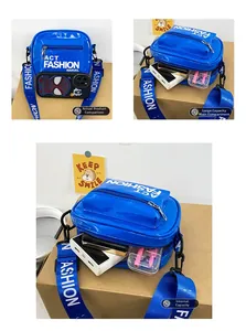 Blue patent leather kids sling bag showing large capacity with internal storage detail