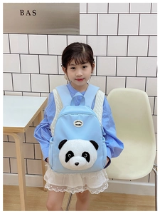 Detail of light blue kids backpack with 3D plush panda and Little Rabbit logo patch