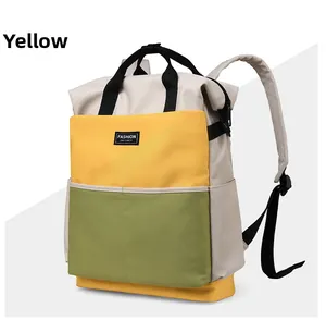Close-up of tricolor nylon diaper bag in yellow, beige and green with side zipper detail