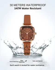 Detail of rose gold square watch with water splashes showing 30M water resistance