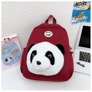 Detail view of the red 3D plush panda backpack for kids with a cute cartoon design