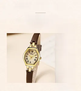 Macro detail of Gedi mini hex watch featuring a gold case and brown leather strap