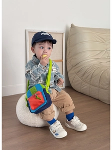 Kids colorful crossbody bag featuring blue, green, and orange contrast panel design