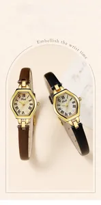Close-up of elegant hexagonal gold quartz watches with brown and black leather straps