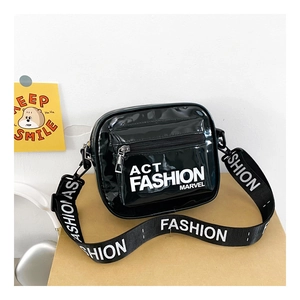 Detail of black glossy crossbody bag with Marvel logo and letter print wide strap