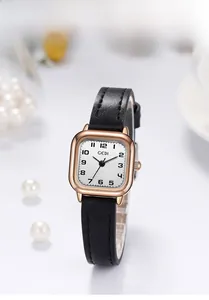 Detail of GEDI square watch with rose gold case, black leather strap and pearl accents