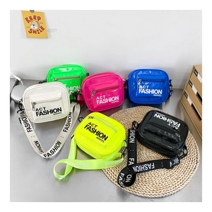 Glossy patent leather kids crossbody bags in six vibrant colors with wide logo straps