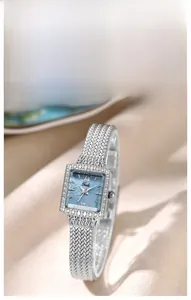 Detailed close-up of square mother-of-pearl dial and diamond-set bezel of Gedi watch
