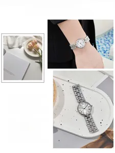 Detail shot of vintage silver women's watch featuring Roman numerals and metal strap