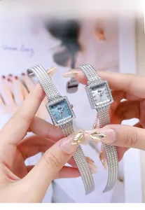 Detailed comparison of two Gedi quartz watches with mother-of-pearl square dials