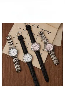 Classic women watches with roman numerals, blue hands on vintage wood and linen