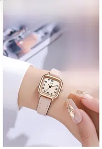 Elegant square GEDI watch with rose gold case and cream leather strap on female wrist