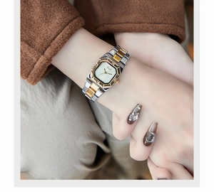 Detail of Gedi vintage bicolor metal watch showing octagonal dial on female wrist