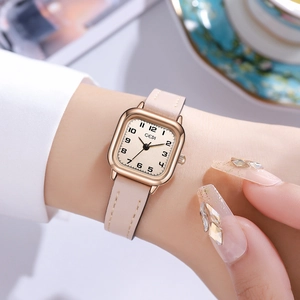 Elegant women's square quartz watch with rose gold case and pink leather strap worn on wrist