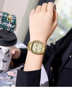 Macro detail of GEDI women's gold quartz watch with calendar display and square dial