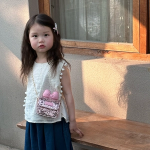 Chic kids pink sequin crossbody bag featuring a cute bow and stylish metal chain strap