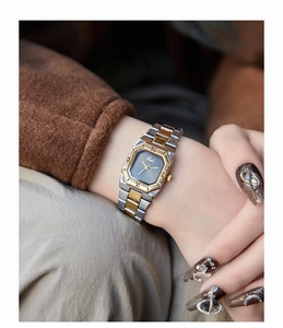 Gedi two-tone octagonal watch with Roman numeral bezel shown on a female wrist