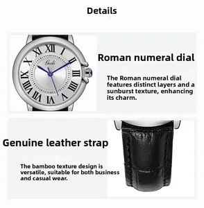 Detail of Roman numeral silver dial with blue hands and black leather watch strap
