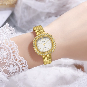 Reloj de lujo GEDI dorado para mujer con bisel de diamantes y correa de malla metálica