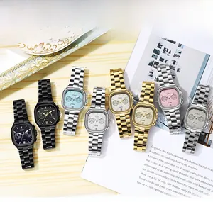Detailed flat lay of luxury square dial business watches with metal link straps and sub-dials