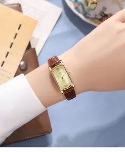 Detailed view of GEDI vintage square watch with brown leather strap on wrist
