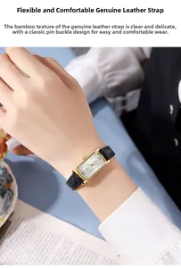 Close-up of vintage square watch with gold case and black bamboo pattern leather strap