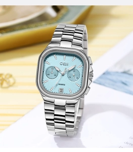Detail view of the GEDI silver steel watch case with ice blue dial and side buttons