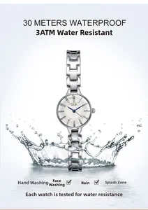 Detail shot of silver quartz watch showing 3ATM water resistance with water splashes