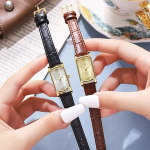 Retro women's quartz watch with rectangular gold case and embossed leather strap