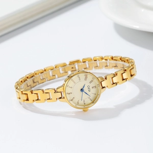 Elegant GEDI gold-plated quartz watch with H-link bracelet strap on minimalist white surface