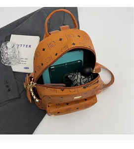 Detailed interior view showing large capacity for tablet and phone in bear print backpack