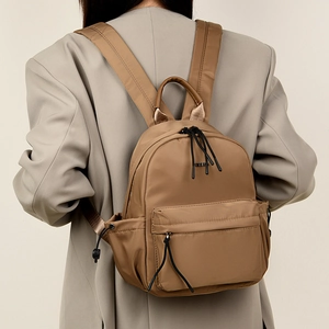 Minimalist brown nylon travel backpack for women with large capacity and waterproof fabric