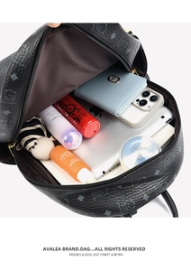 Detailed view of spacious interior storage for tablets and gadgets in black bear backpack