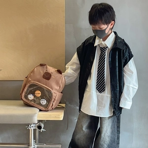 Cute brown capybara backpack for kids styled with a trendy urban fashion outfit