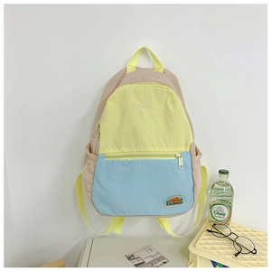 Detail view of large capacity tricolor backpack with side pockets and mountain logo