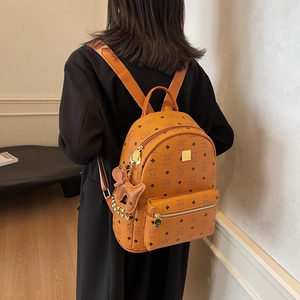 Cute brown cartoon bear backpack with large capacity and stylish all-over print