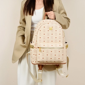 Fashionable beige backpack with cartoon cat patterns and gold studs for women