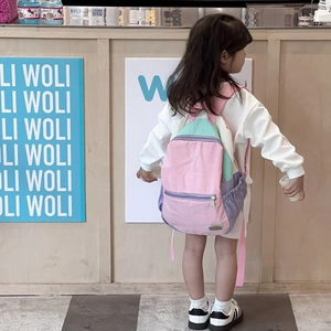 Kids color-block backpack in macaron tones with ergonomic straps for school and travel